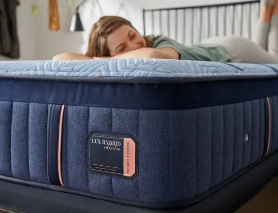 stearns-and-foster-lux-estate-hybrid-woman-lying-down